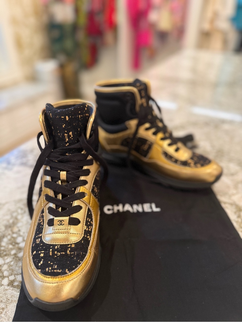 CHANEL Women’s Black and Gold High-Top Sneakers